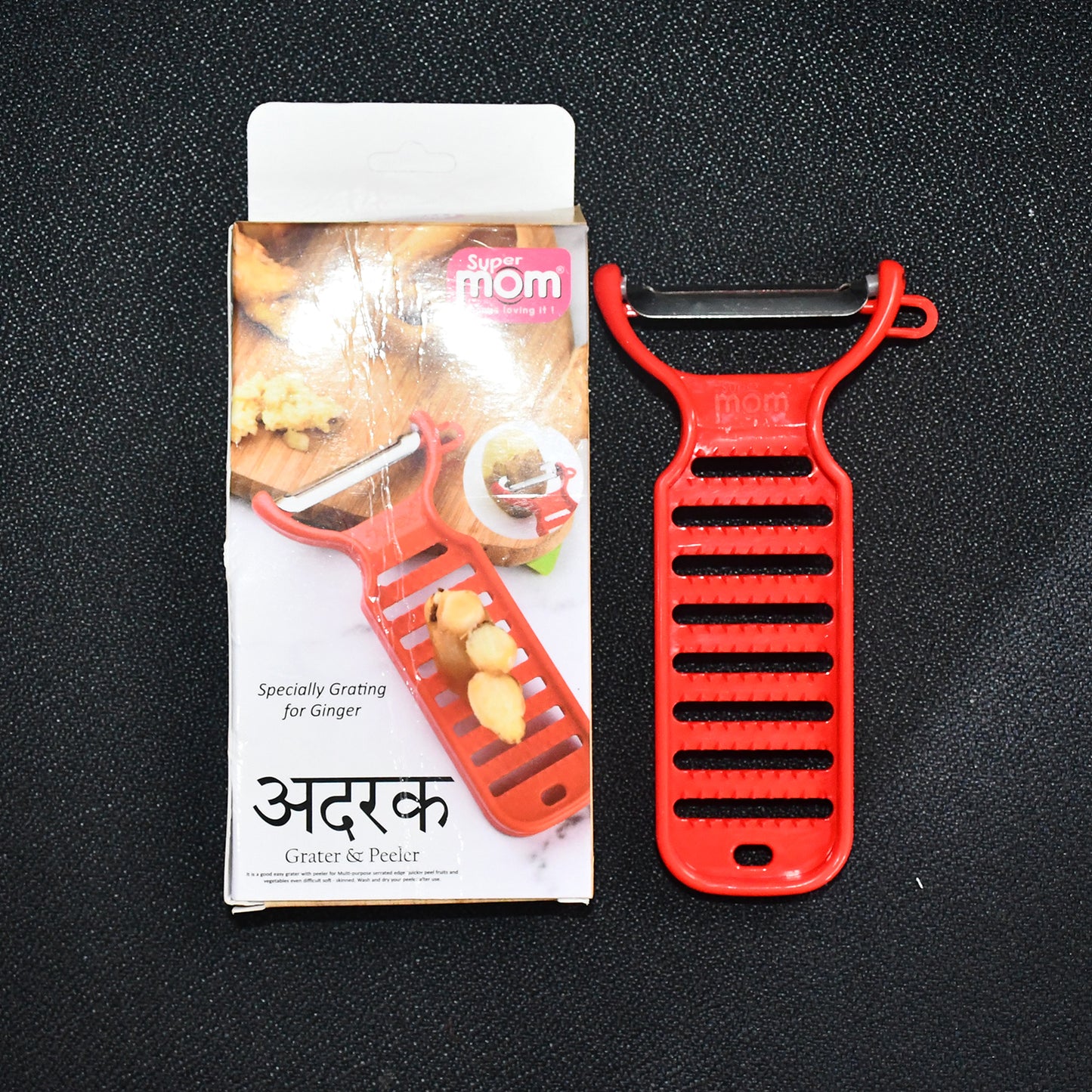 Wukusy Supermom ginger grater and peeler in white, compact kitchen tool for fresh ginger preparation, shown on a wooden surface.