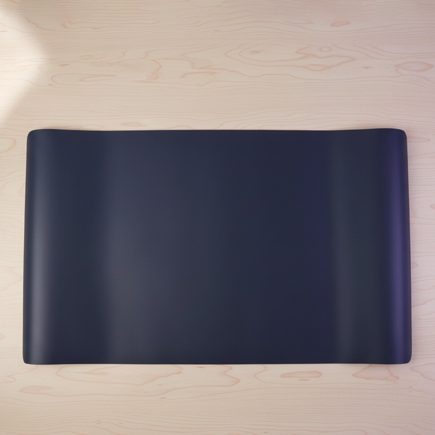 Large Wukusy premium desk mat and mouse pad, 60x35 cm, with smooth surface for comfortable computer use.
