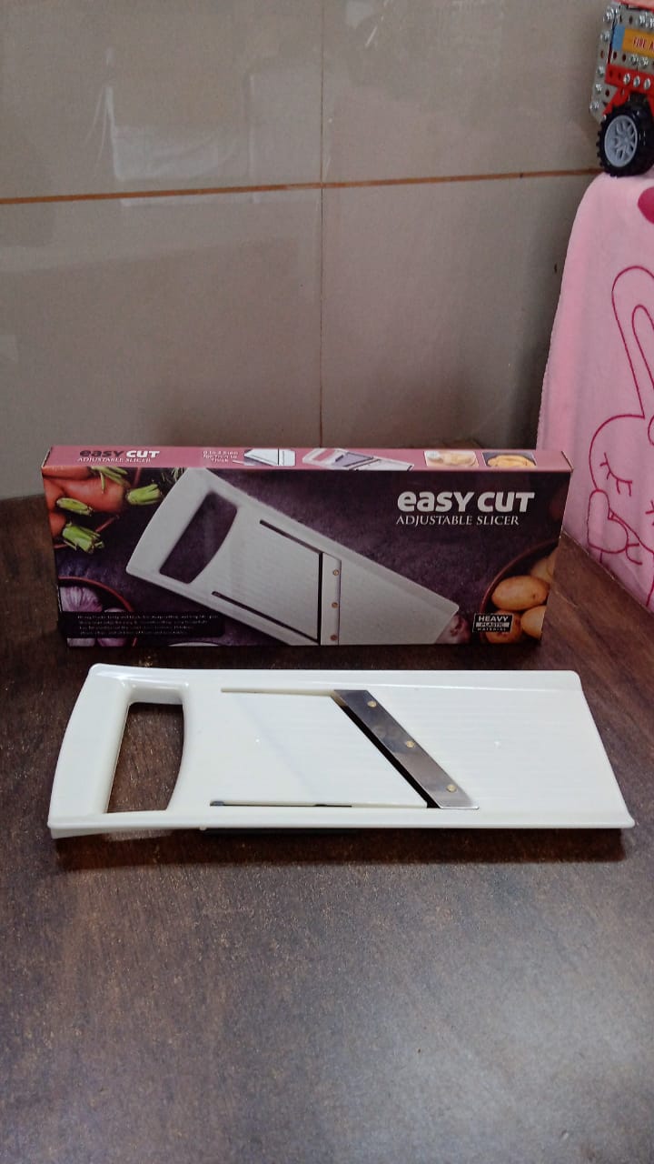 Wukusy adjustable fruit and vegetable slicer with stainless steel blades for precise home kitchen slicing, shown on a countertop.