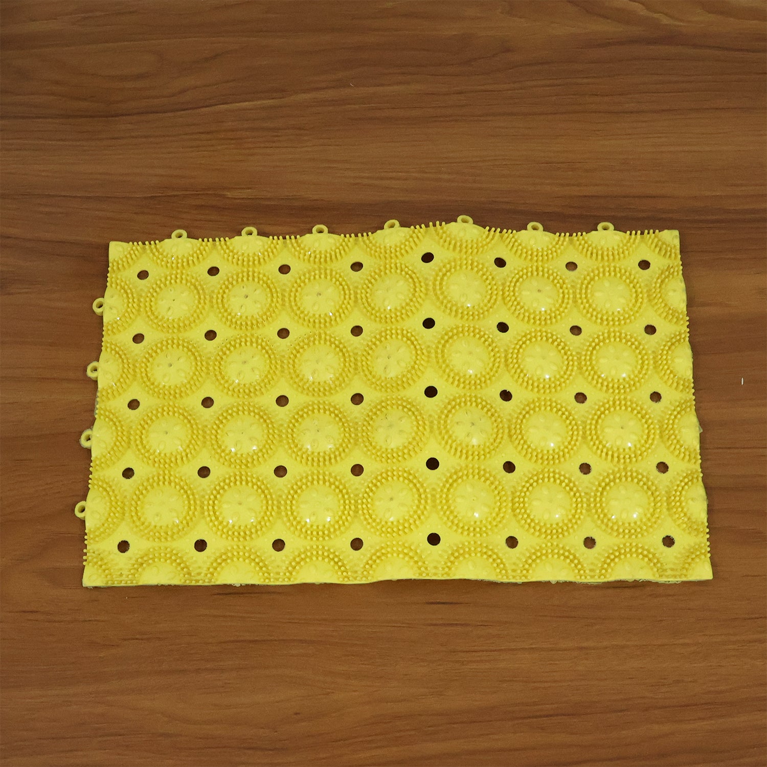 Wukusy anti-slip bathroom massage mat with suction cups, 33x21 cm, showing textured surface and secure suction in a bathroom setting.
