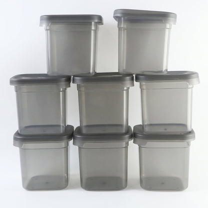 Eight Wukusy plastic food storage containers with 700ml capacity, airtight lids, and clear design for pantry organization.