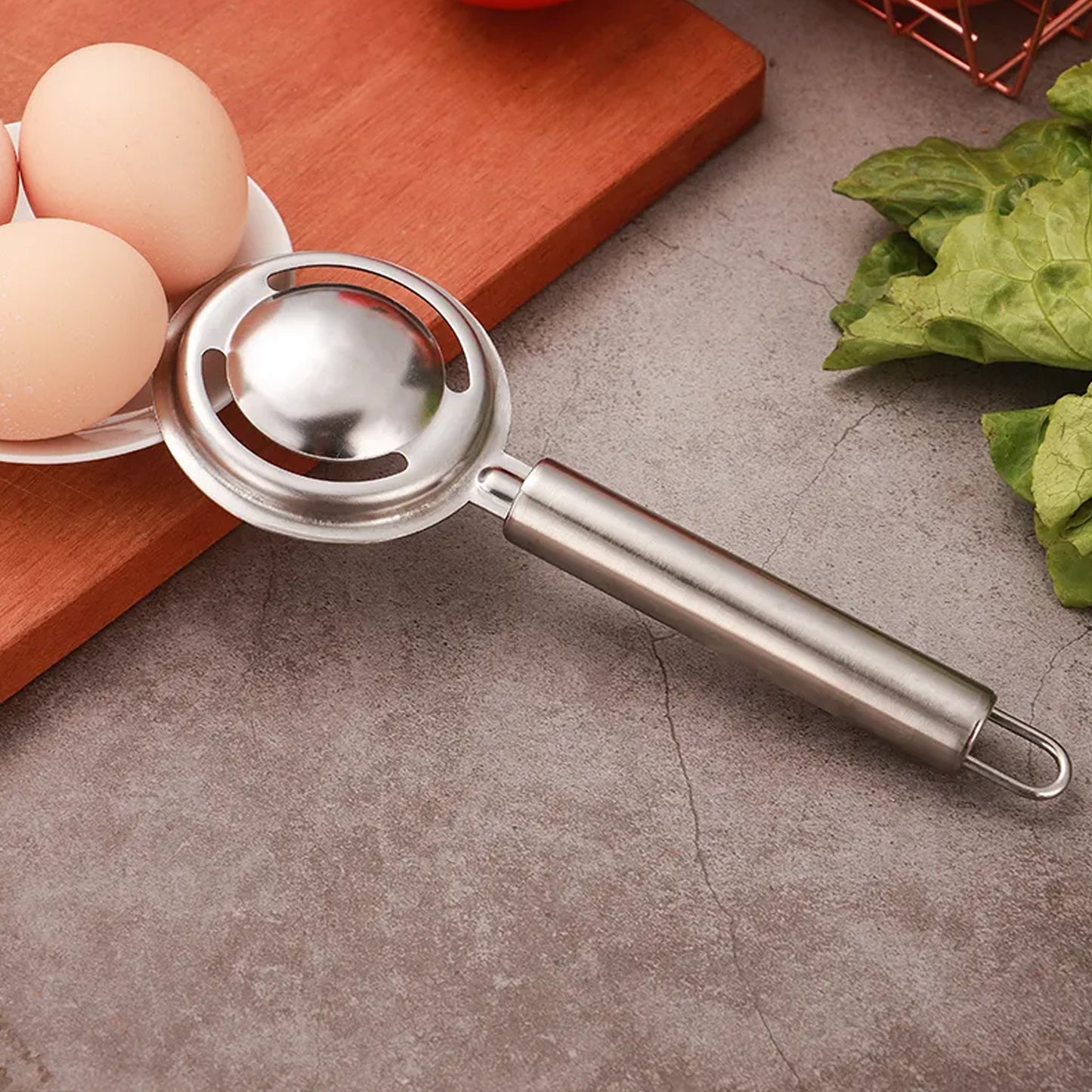 Wukusy stainless steel egg yolk and white separator tool with funnel and spoon for kitchen egg separating tasks.