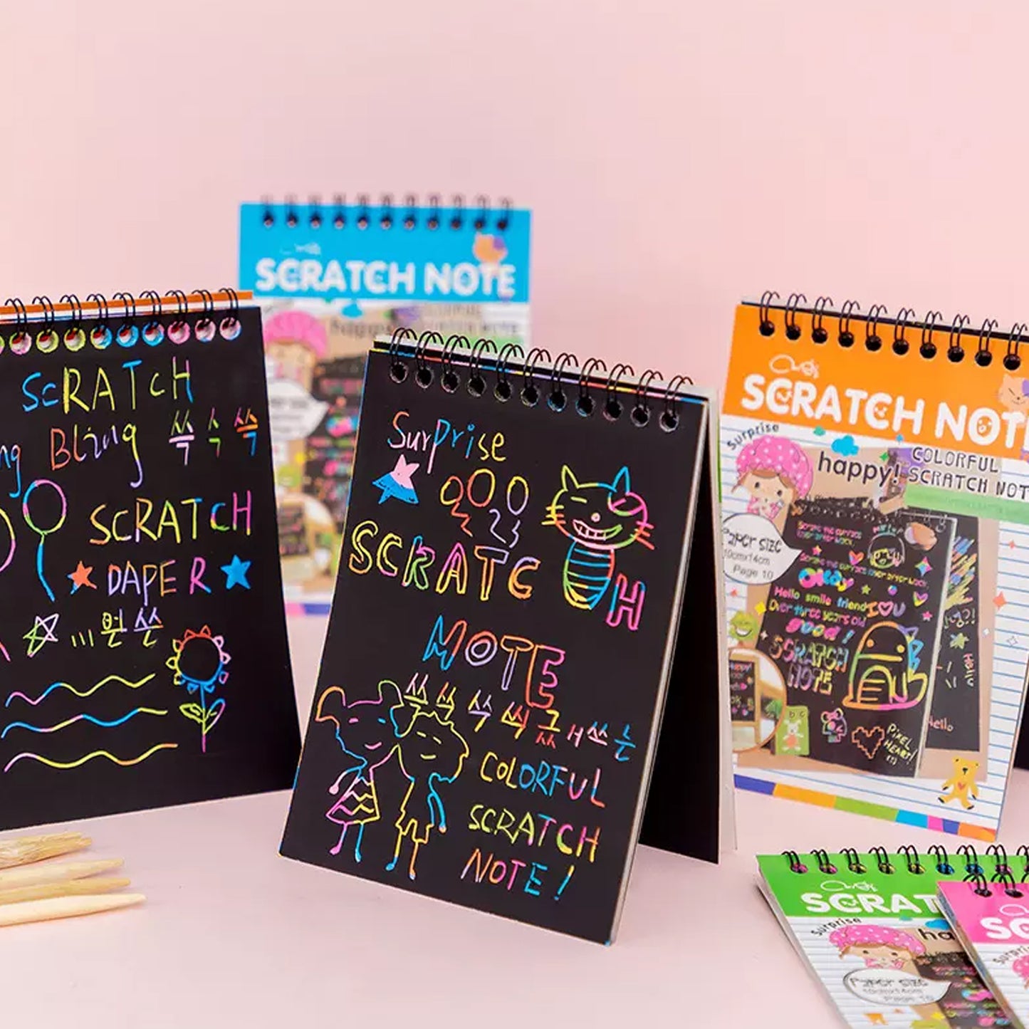 Wukusy Crafts Rainbow Art Scratch Paper Book with 10 colorful pages for creative drawing and craft projects.