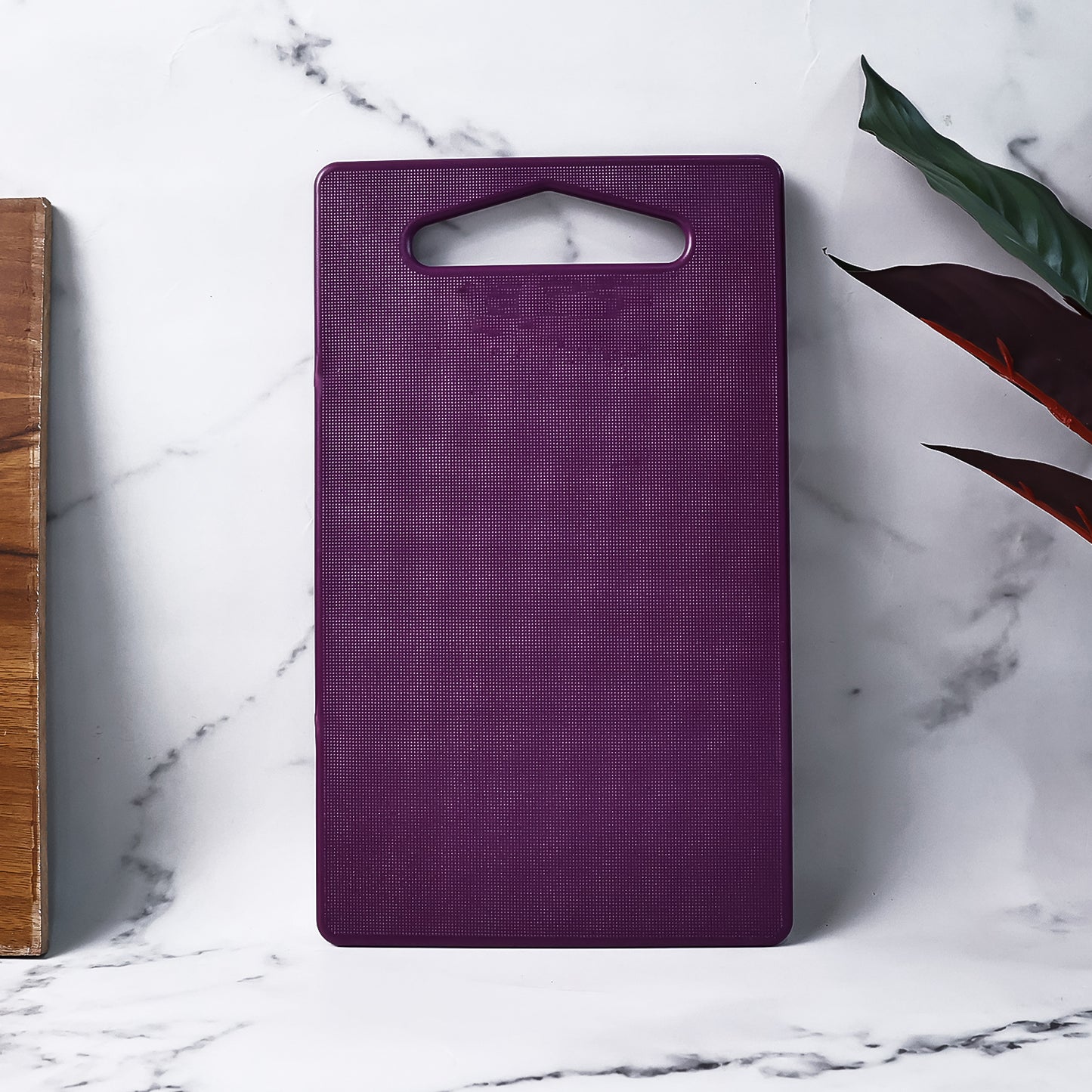 Wukusy Supermom Little Master unbreakable cutting board for kitchen prep, durable plastic surface, compact and lightweight design
