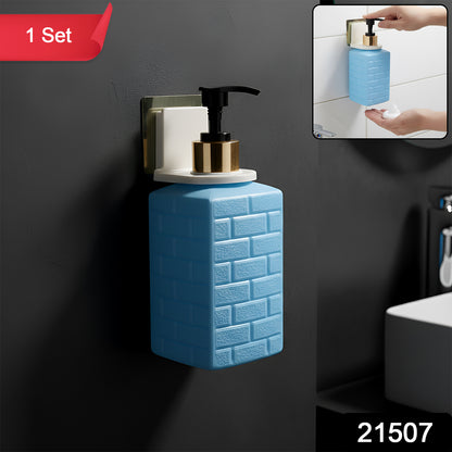 Wall-mounted Wukusy liquid soap dispenser set with sleek design and pump mechanism, mounted on a bathroom wall.