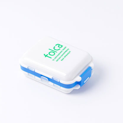 Blue Wukusy portable dual-sided pill organizer box with multiple compartments for medication storage and organization.