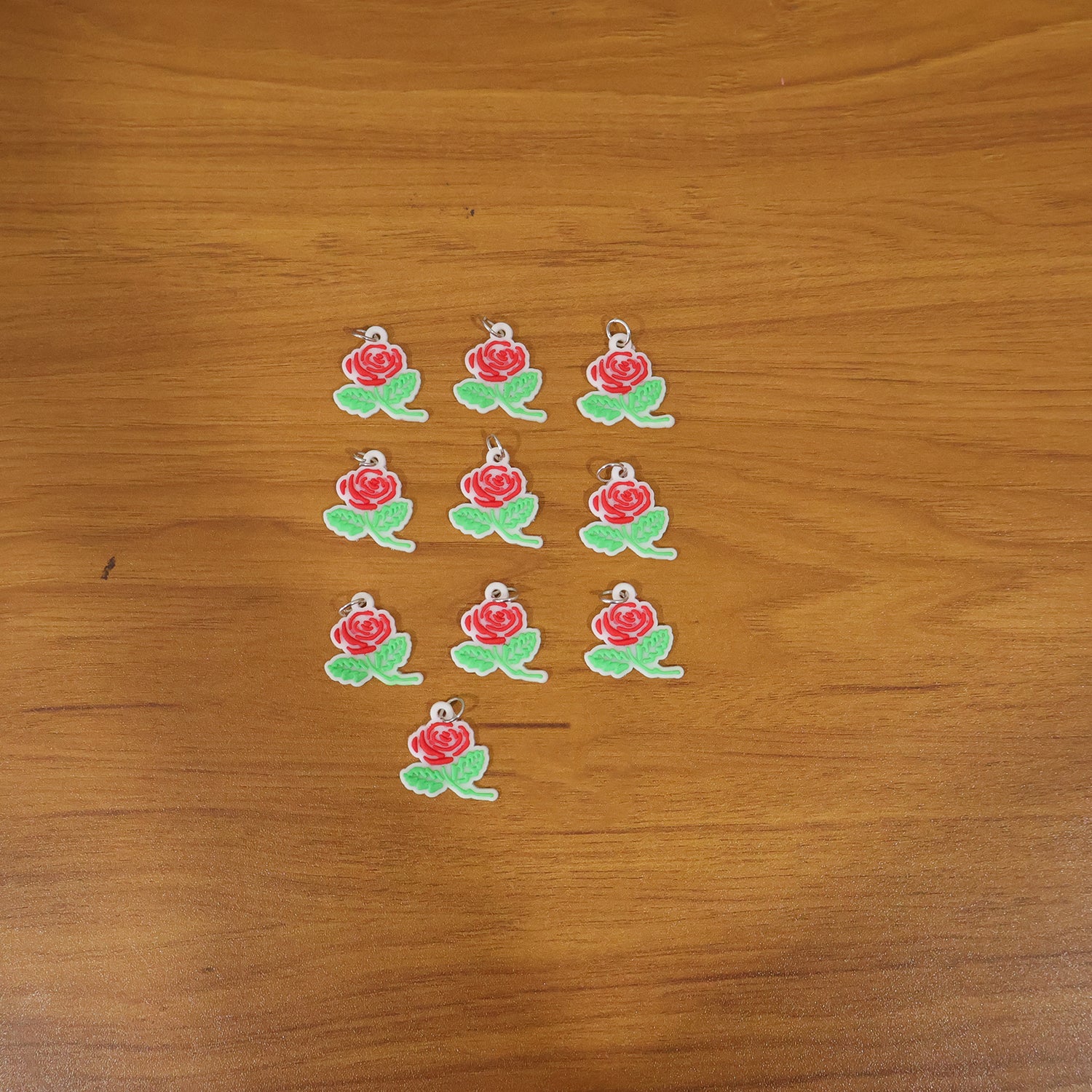 Set of 10 Wukusy rose flower design bag charm keychains featuring colorful, decorative floral accessories for bags and keys.