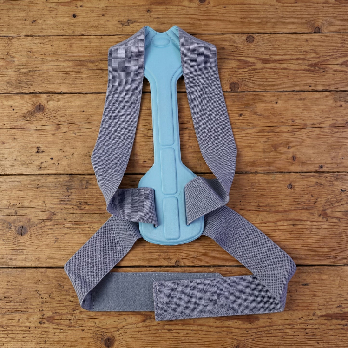 Wukusy ergonomic adjustable back posture corrector support belt in small size, designed to improve posture and provide back support.
