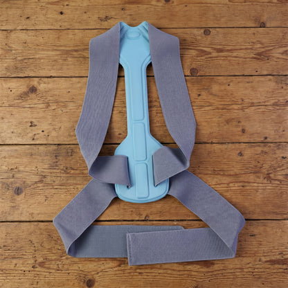 Wukusy ergonomic adjustable back posture corrector support belt in small size, designed to improve posture and provide back support.
