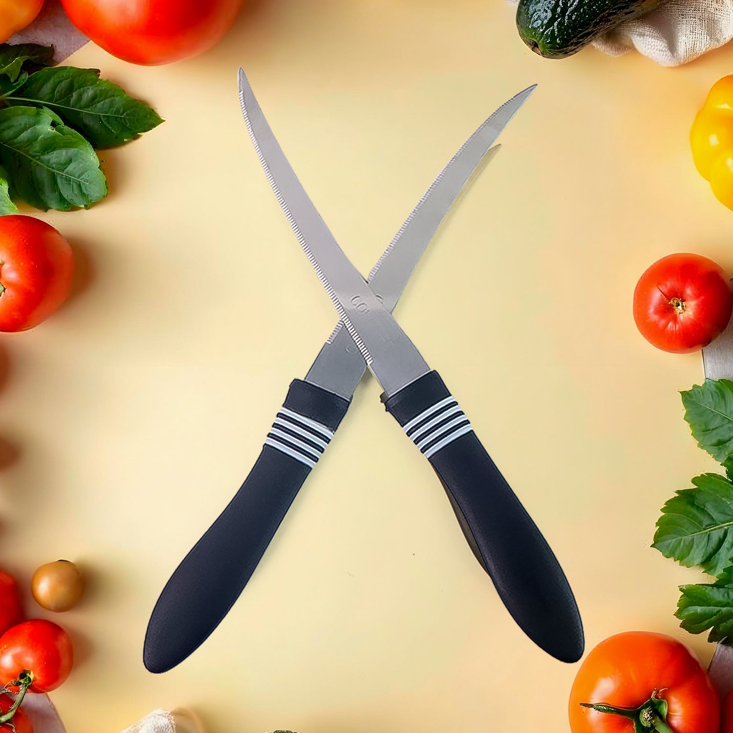 Wukusy premium curved serrated stainless steel kitchen knife set with two colorful knives on a wooden cutting board.