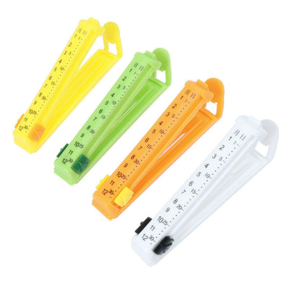 Wukusy 6309 4-piece food sealing clips for packing food items to prevent contamination in kitchen use.