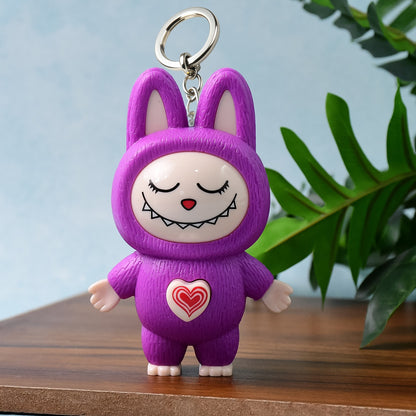 Wukusy cartoon character face-changing toy with key holder keychain, colorful toy with adjustable face features and attached keyring.