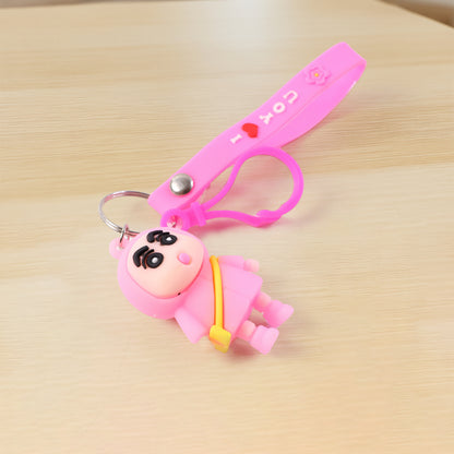 Cute cartoon doll figure keychain by Wukusy featuring a colorful, playful doll design attached to a metal keyring.