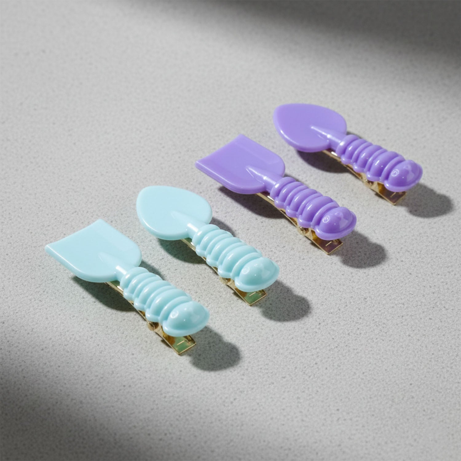 Set of four Wukusy cute spoon and spatula-shaped decorative hair clips with playful, colorful designs for fun hair accessories.