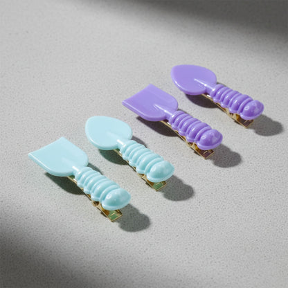 Set of four Wukusy cute spoon and spatula-shaped decorative hair clips with playful, colorful designs for fun hair accessories.