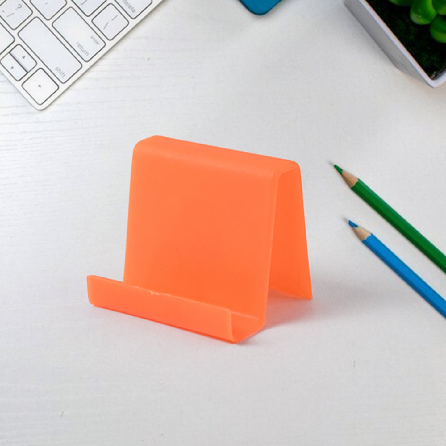 Colorful plastic mobile phone stand with angled support, durable and compact, perfect for hands-free viewing by Wukusy.