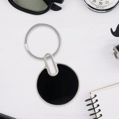 Black round metal keychain by Wukusy, featuring a sleek design and durable metal construction for everyday use.