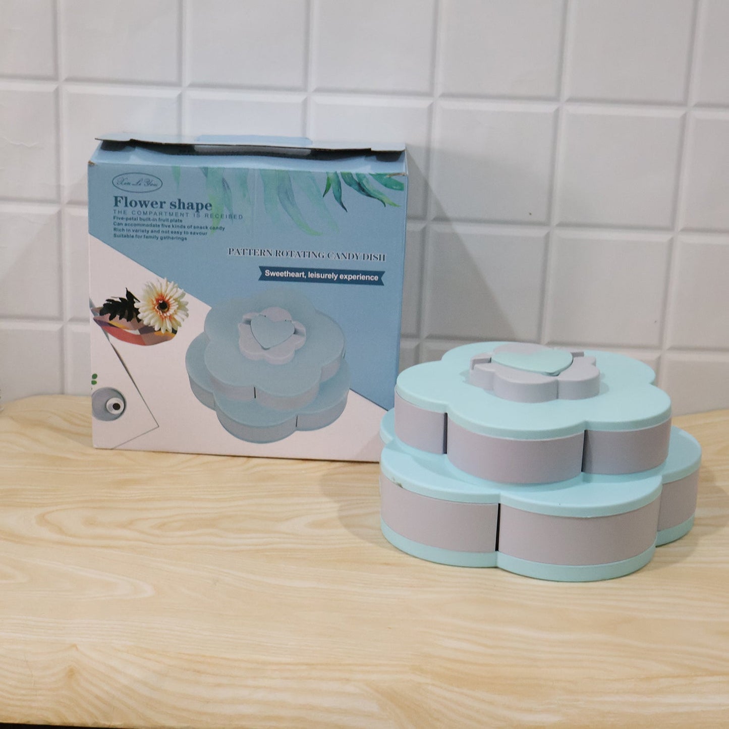 Wukusy rotating flower-shaped candy dish and snack box with multiple sections and phone holder, colorful and practical kitchen organizer.