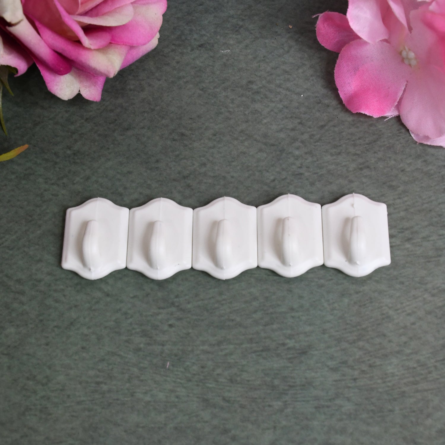 Set of 10 small adhesive hooks for wall hanging by Wukusy, ideal for home and kitchen organization.