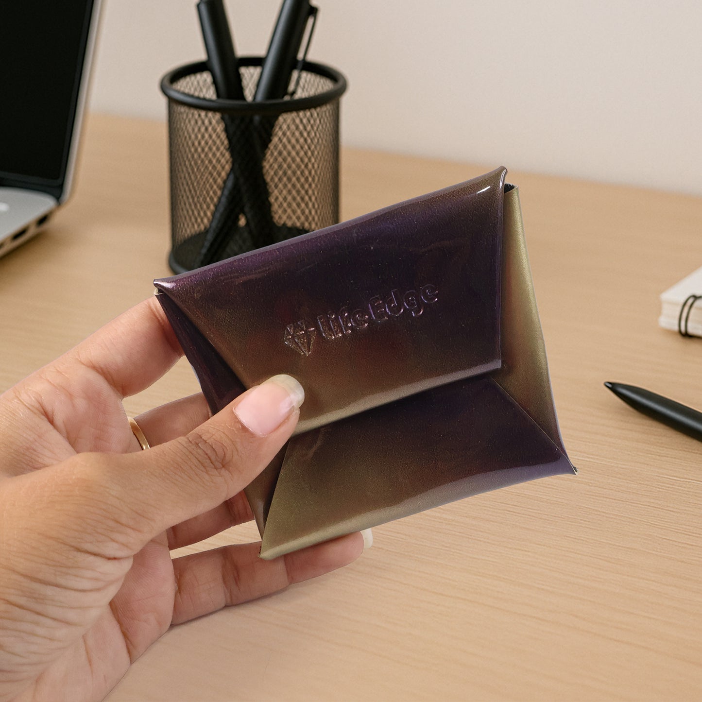 Premium foldable PU leather coin pouch by Wukusy with compact design and secure closure, ideal for organizing coins and small items.