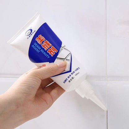 Waterproof Wukusy silicone grout sealant tube for repairing tile and sink gaps in bathrooms, kitchens, and home improvement projects.