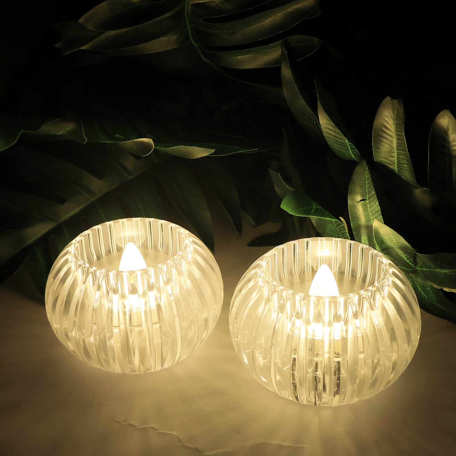 Set of 12 Wukusy LED crystal-effect flameless smokeless decorative candles for home decor, with glowing crystal-like appearance.