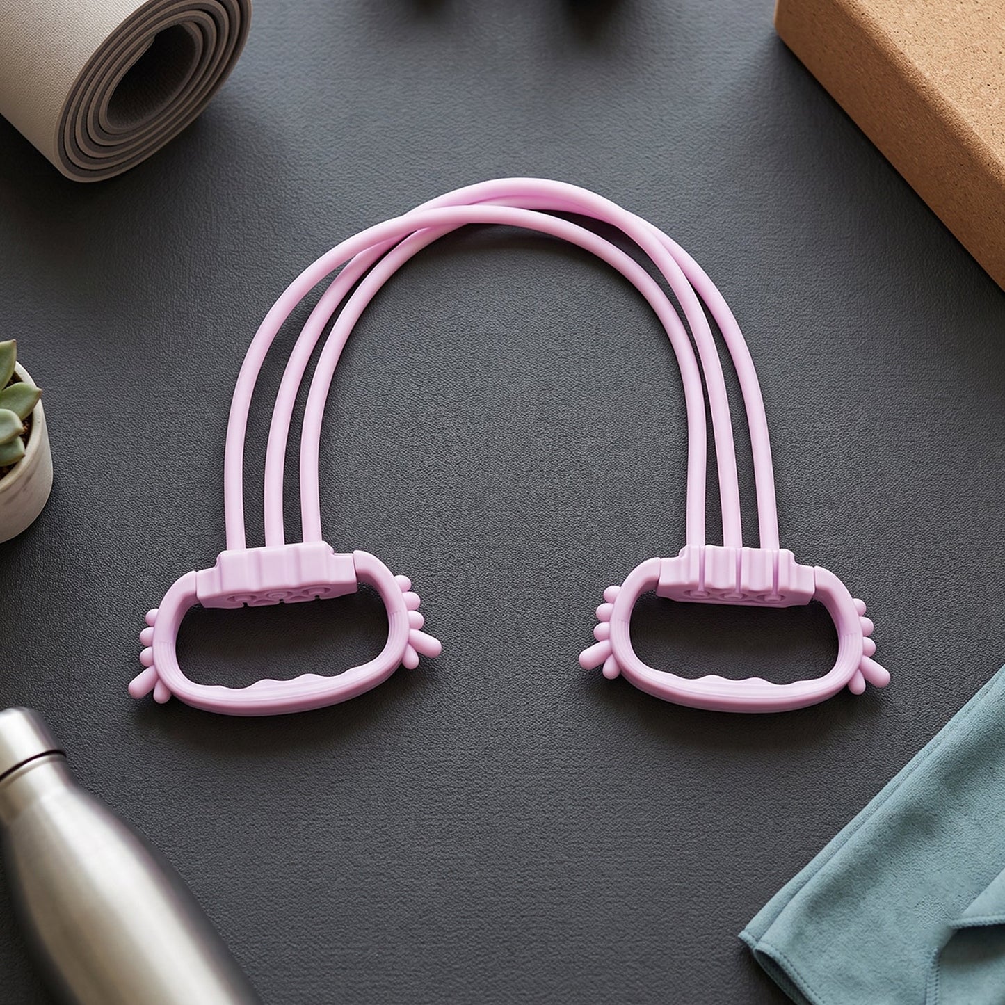 Wukusy multifunctional chest expander puller with three resistance tubes for home gym workouts, showing the assembled device with handles.