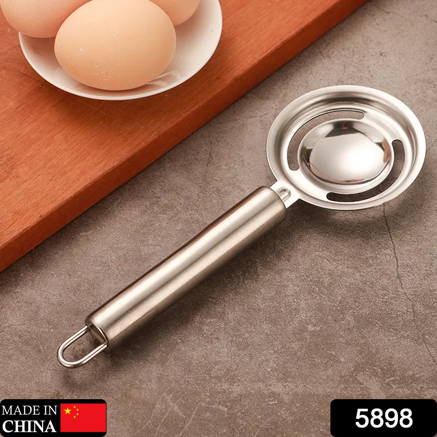 Wukusy stainless steel egg yolk and white separator tool for kitchen use, featuring a funnel and spoon for easy egg separation.