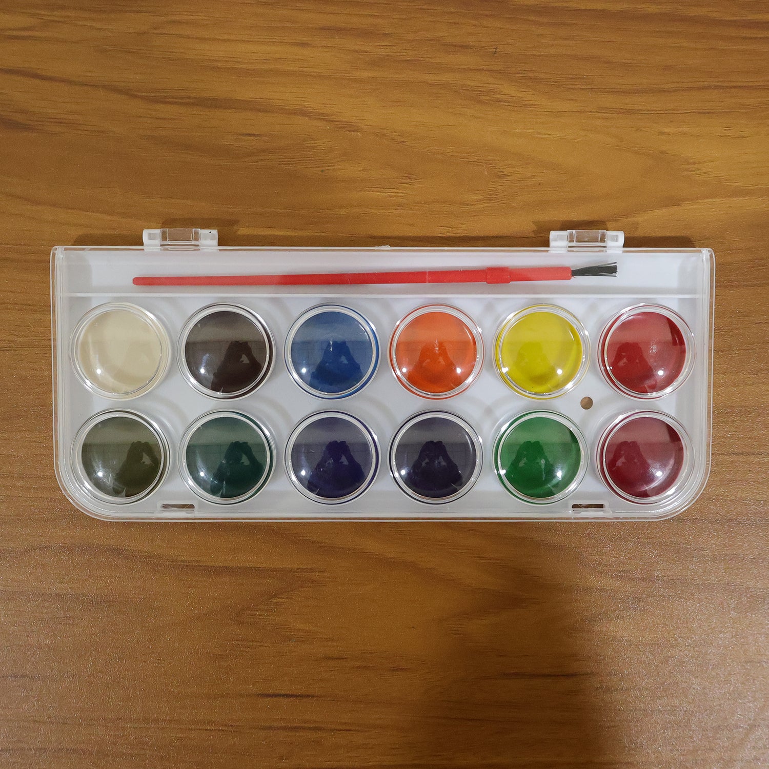 Wukusy 12-shade compact watercolor paint set with vibrant colors and portable metal case, ideal for artists and painters.