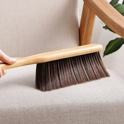 Wukusy dust cleaning brush with wooden handle and soft bristles for efficient dust removal from surfaces.