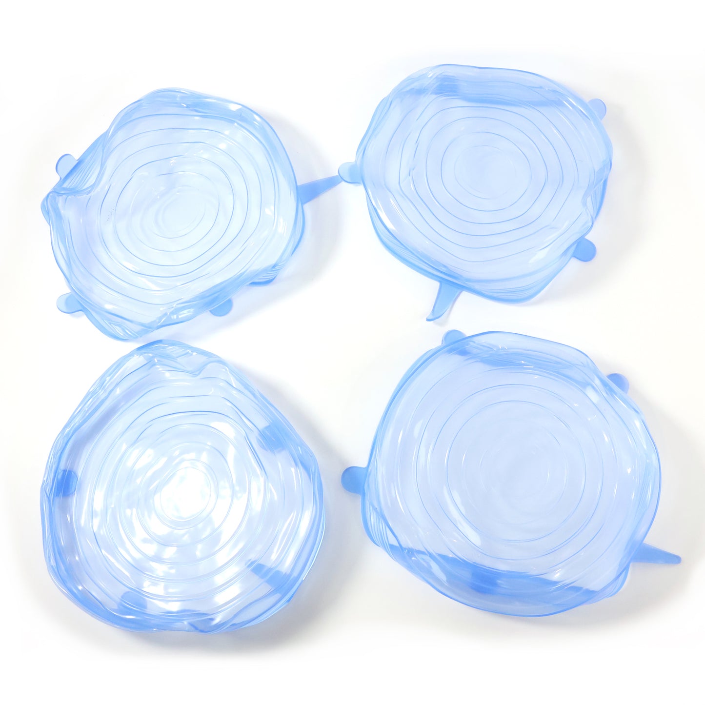 Set of four reusable silicone stretch lids by Wukusy, flexible and airtight for food storage on bowls and containers.