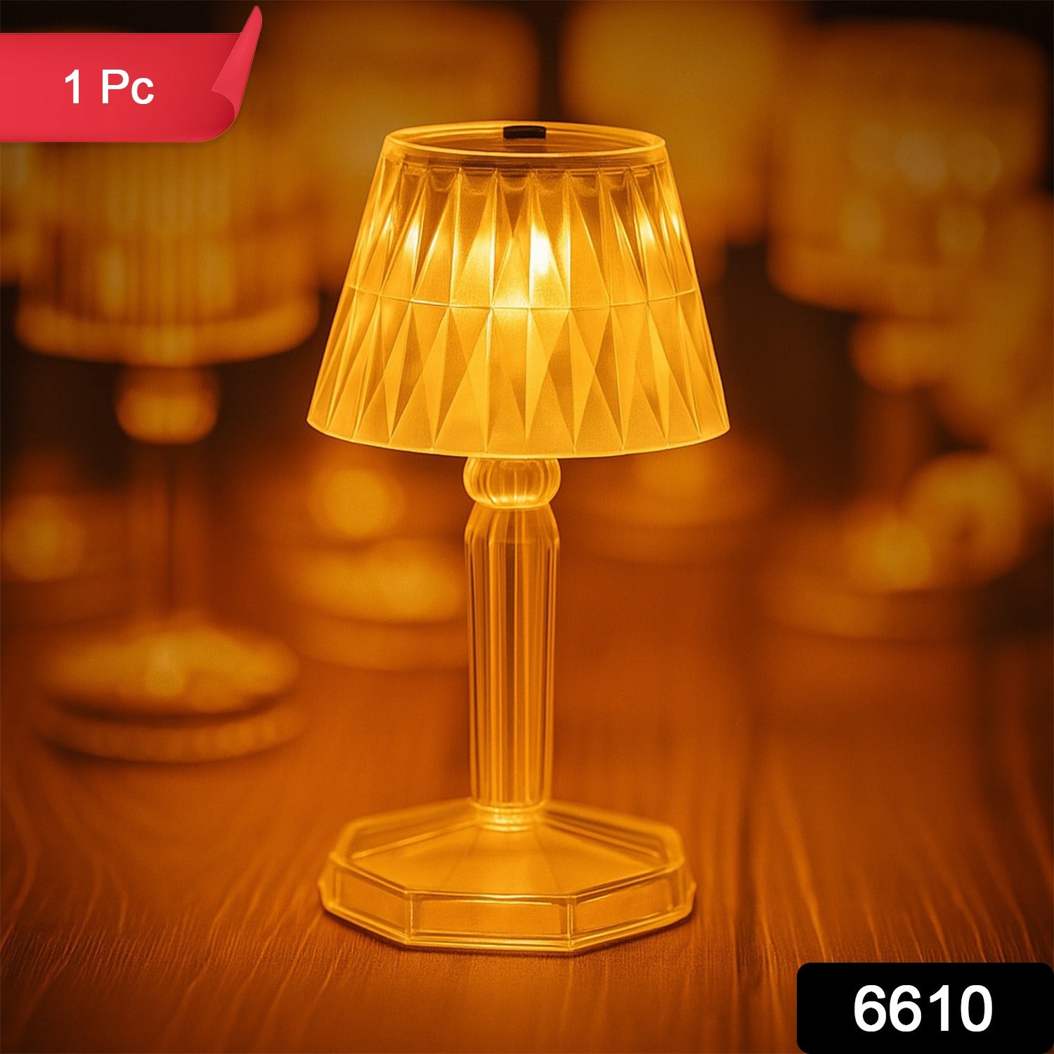 Wukusy 6610 2-in-1 transparent mini crystal table lamp with reflection light, showcasing its sleek design and glowing crystal base.