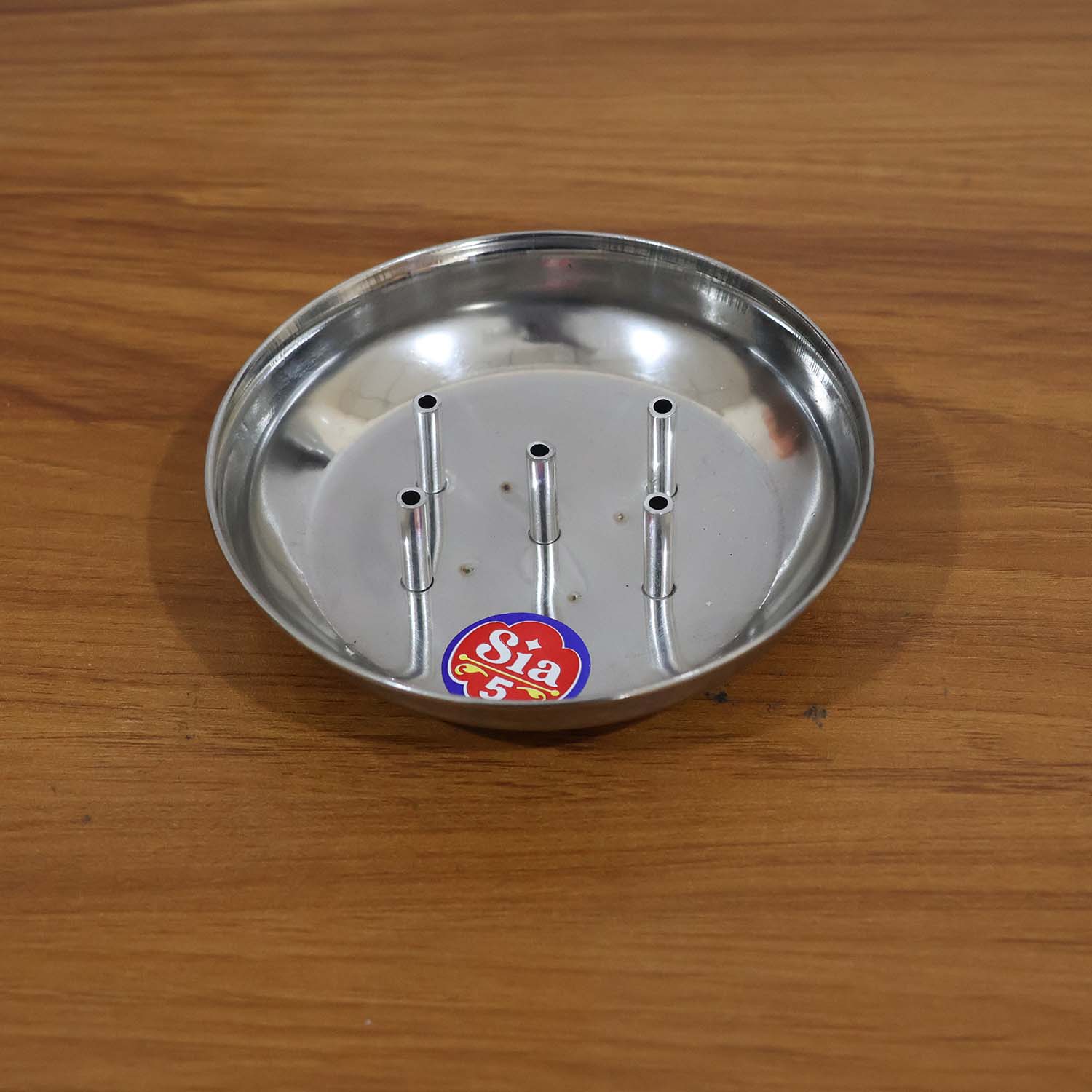 Stainless steel Agarbatti stand by Wukusy with multiple holders for incense sticks, sleek and durable design.