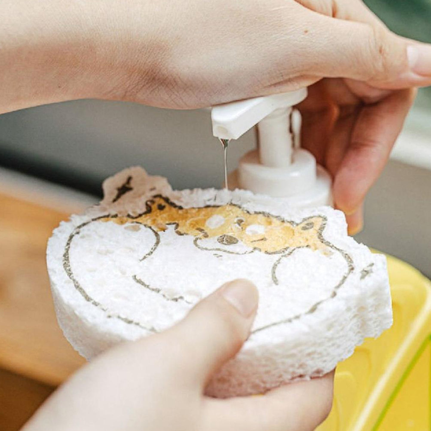 Wukusy 6428a compressed wood pulp sponge with a cartoon design, used as a kitchen dishwashing and cleaning absorbing pad.
