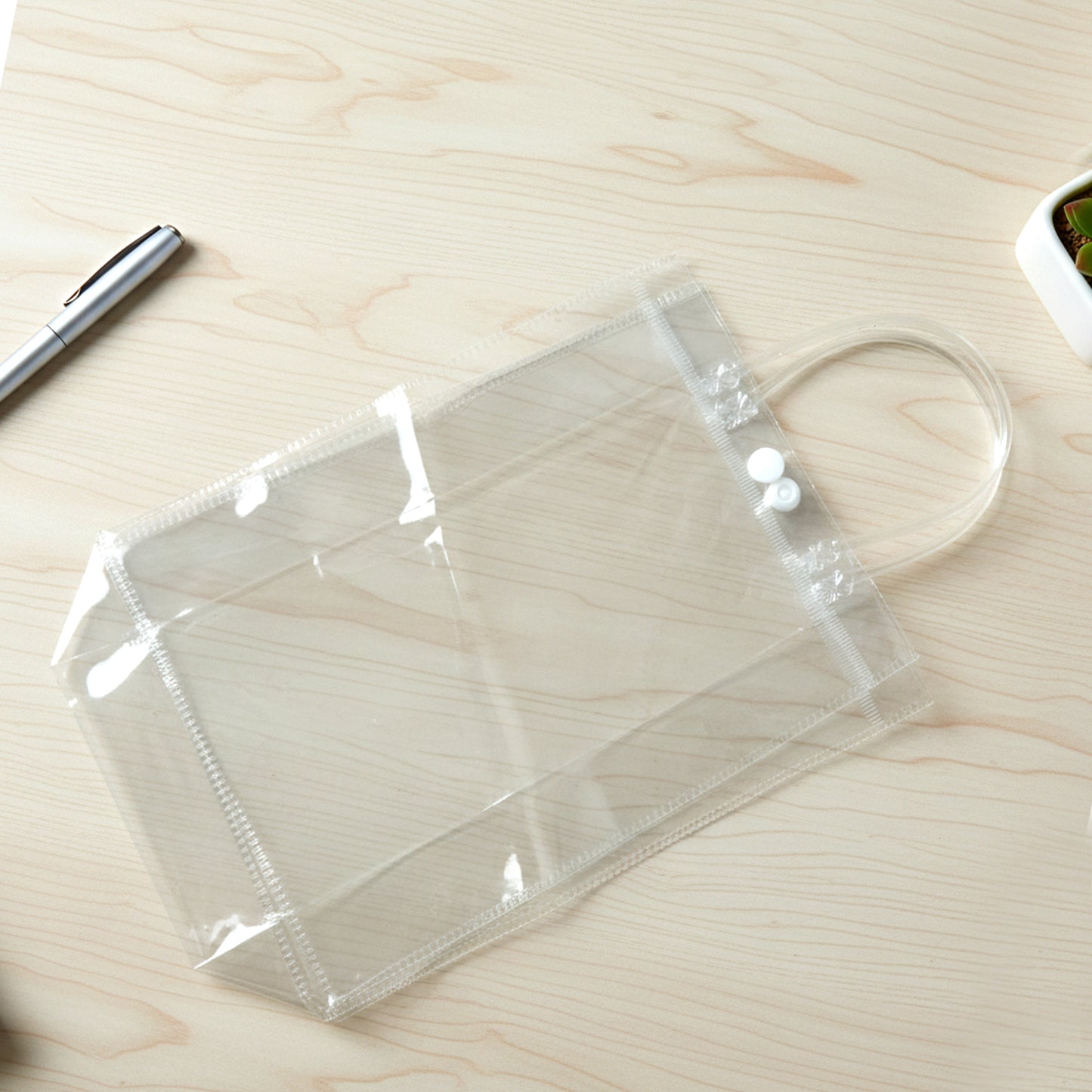Clear PVC carry bag with Wukusy branding, measuring 22x16cm, perfect for organizing and transporting small items.