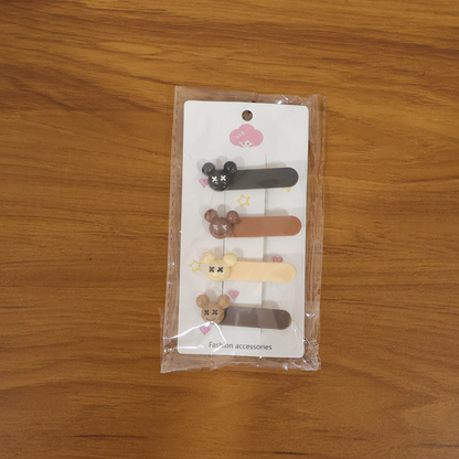 Set of four Wukusy cute cartoon bear design premium fashion hair clips, featuring playful bear faces for kids' hairstyles.