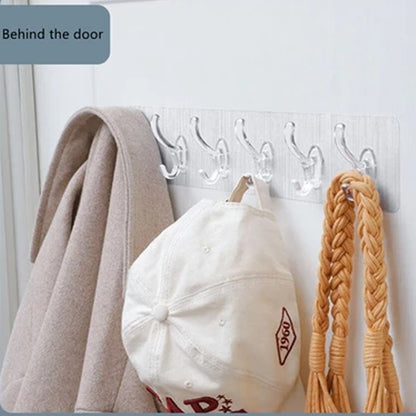 Wukusy 4654 heavy duty transparent adhesive wall hook attached to a wall, ideal for home improvement and hanging lightweight items.