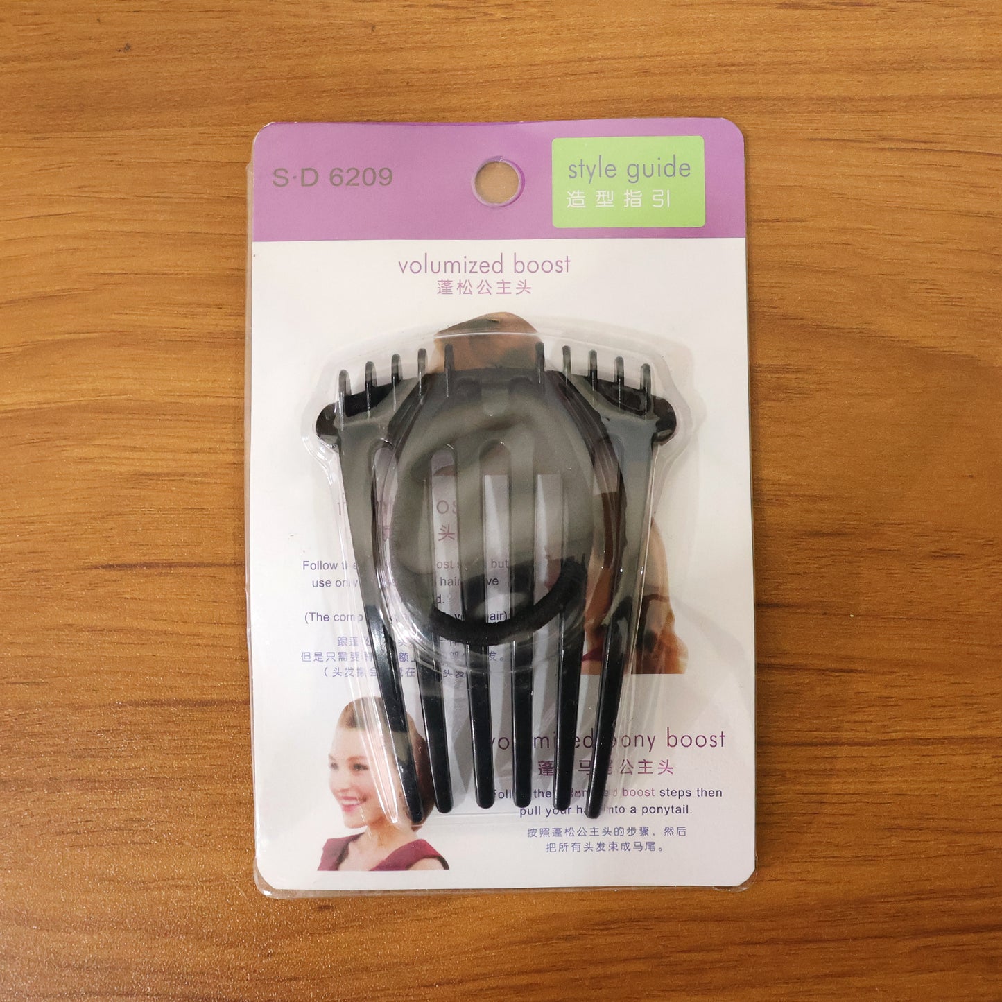Wukusy volumizing hair bun comb clip securing a sleek updo, made of lightweight plastic with teeth for easy styling.