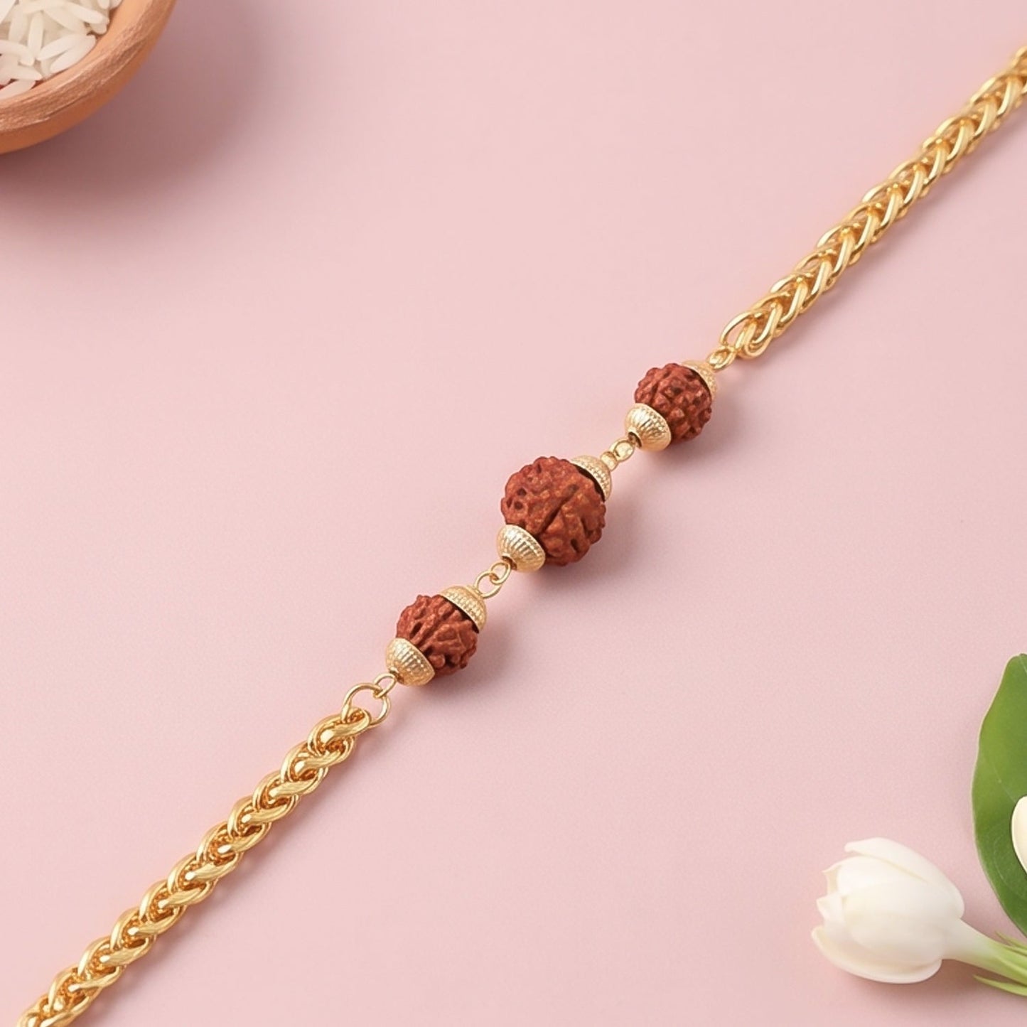 Gold-plated Rudraksha bead Rakhi on a chain for brother, featuring intricate design and traditional Indian craftsmanship.