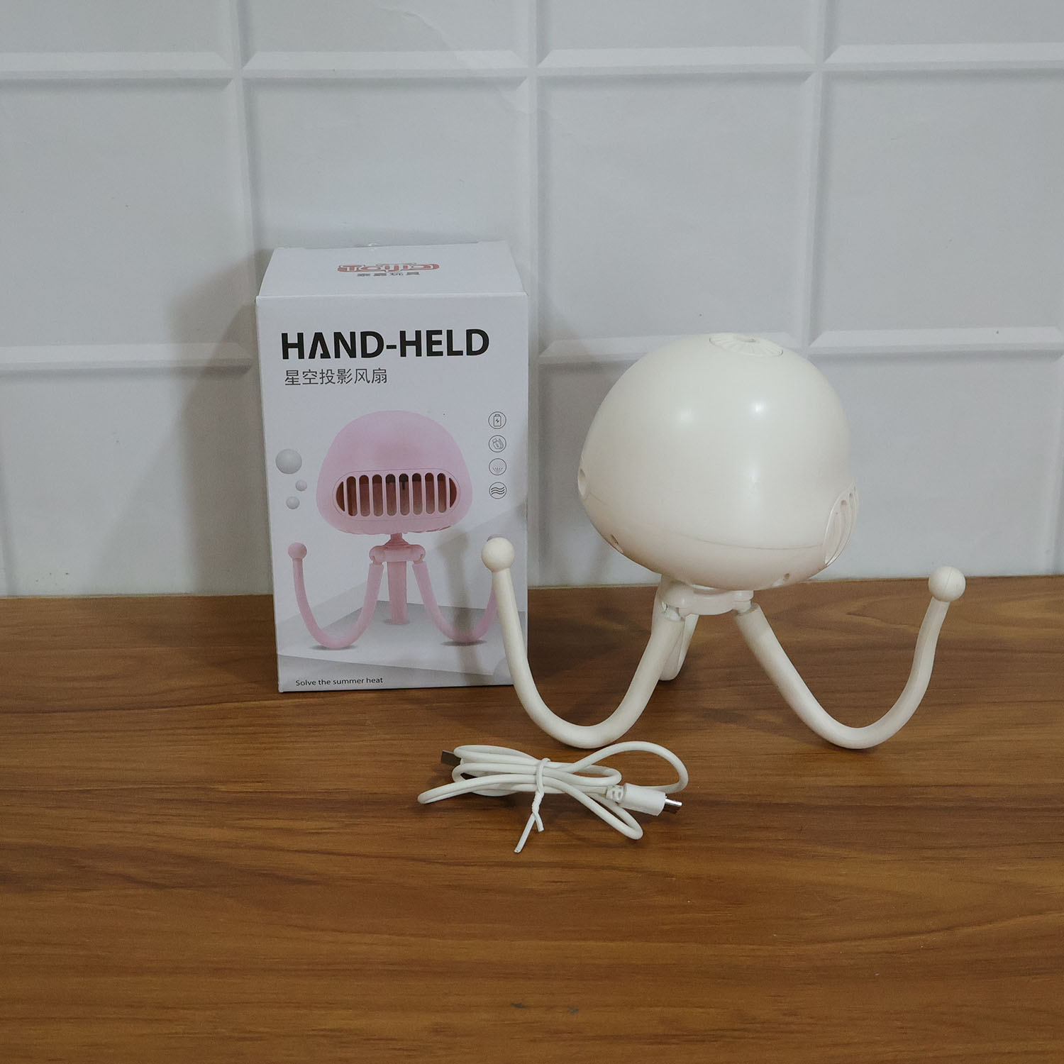 Wukusy rechargeable handheld mini projector fan with foldable design and adjustable tilt, compact and portable for personal use