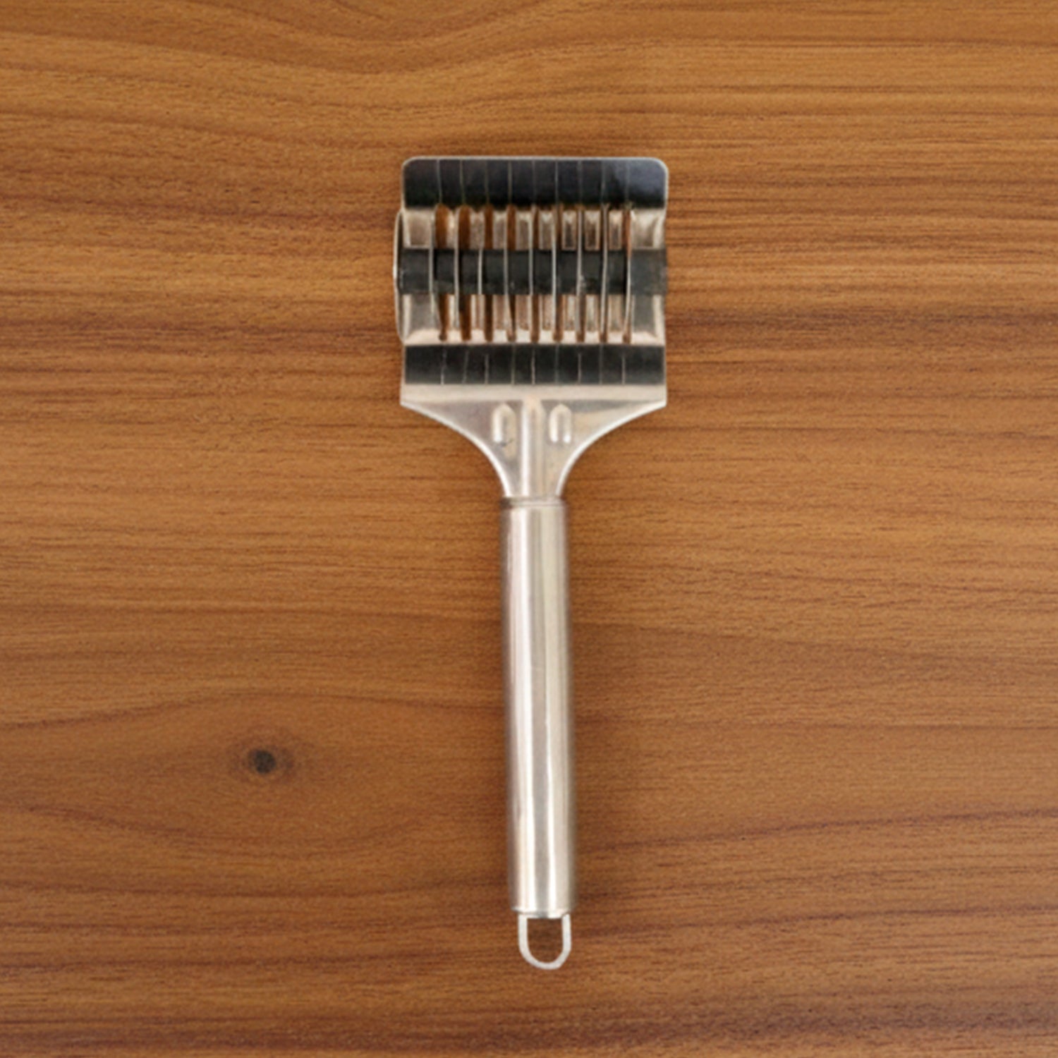 Wukusy manual multi-blade dough cutter roller with multiple blades for precise dough cutting, shown on a clean surface.