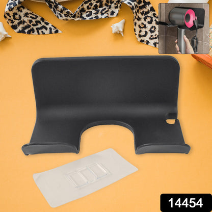 Wall-mounted Wukusy plastic hair dryer holder with space for blow dryer and hair tools, ideal for bathroom or bedroom organization.