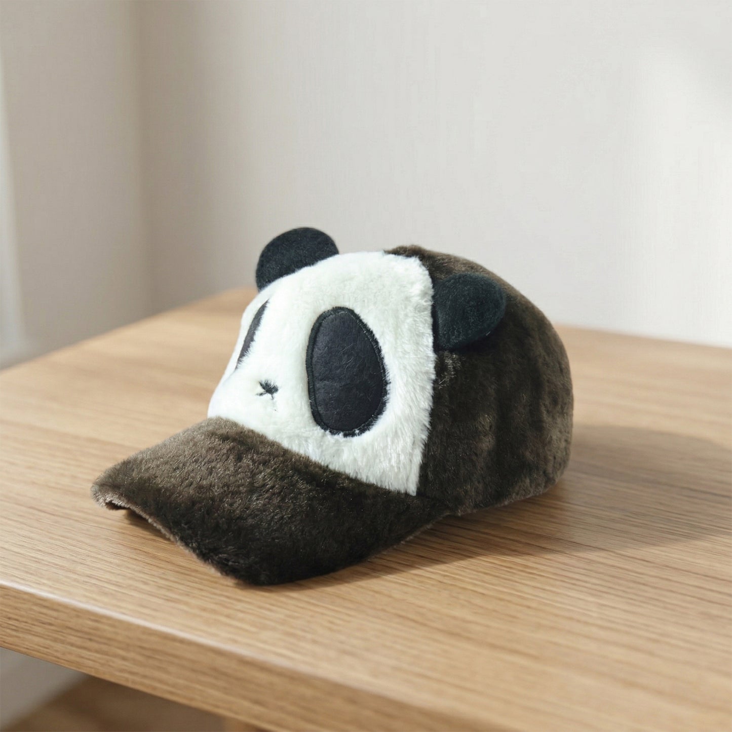 Wukusy cute panda design plush winter cap featuring panda face and ears, cozy and warm for winter wear.