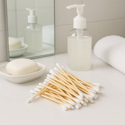 Eco-friendly wooden cotton ear buds from Wukusy, 100-pack, showing natural wooden sticks and soft cotton tips.