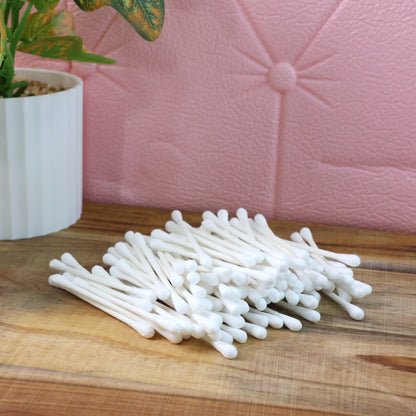 Wukusy paper-stick cotton swabs set with 100 biodegradable cotton swabs for health and beauty use, arranged in a clear container.