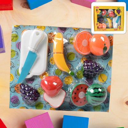 Set of 7 realistic sliceable fruit toys by Wukusy, including apples, oranges, and bananas with wooden blades for pretend play.