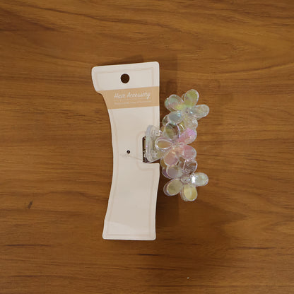 Elegant transparent floral hair claw clip by Wukusy, showcasing a delicate design with floral accents on clear plastic.