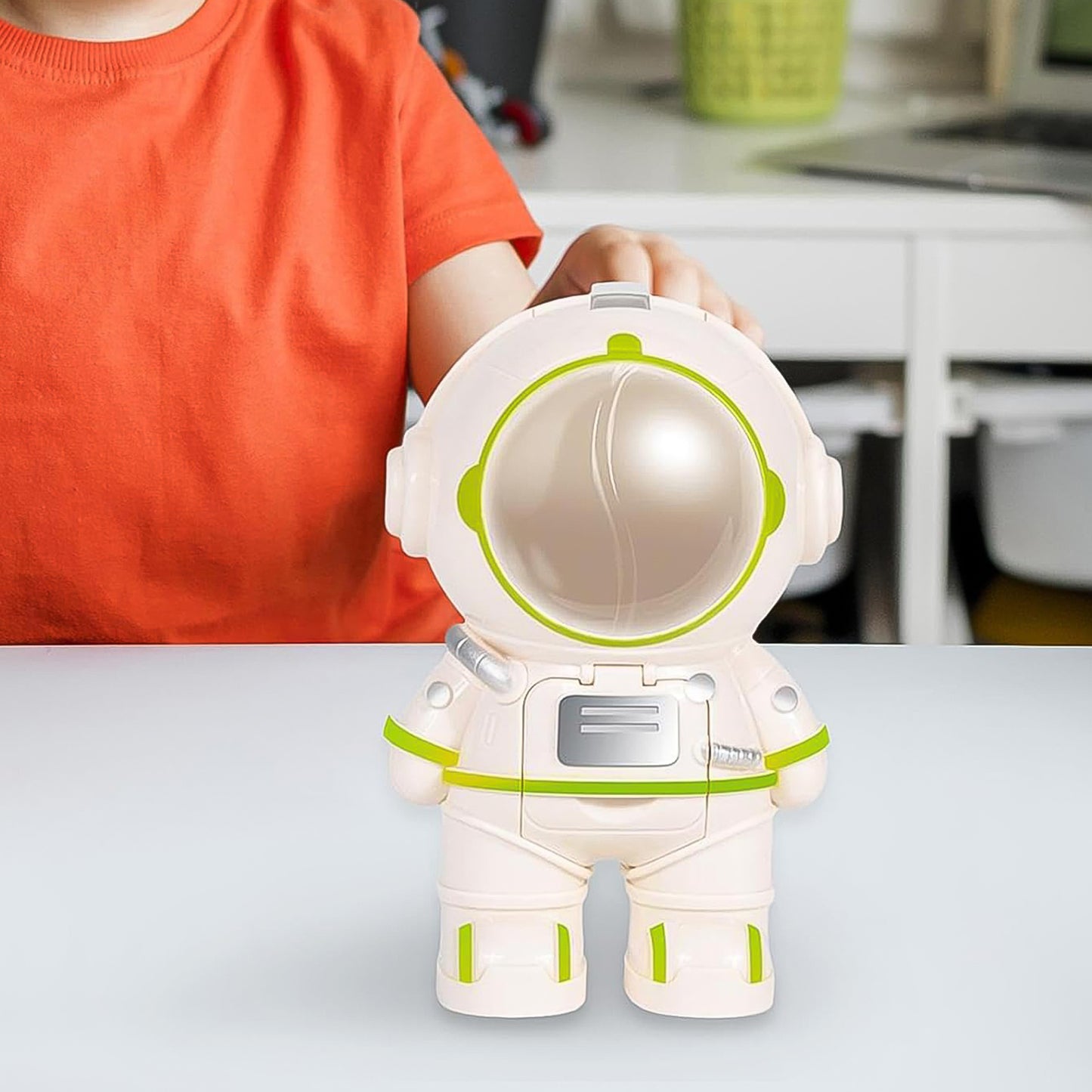 Wukusy astronaut-shaped water dispenser cup for kitchen use, featuring a playful design and easy-to-use water dispensing spout.