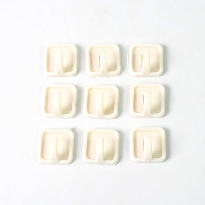 Set of 9 Wukusy adhesive hooks for wall hanging clothes, strong and easy to install for household organization.
