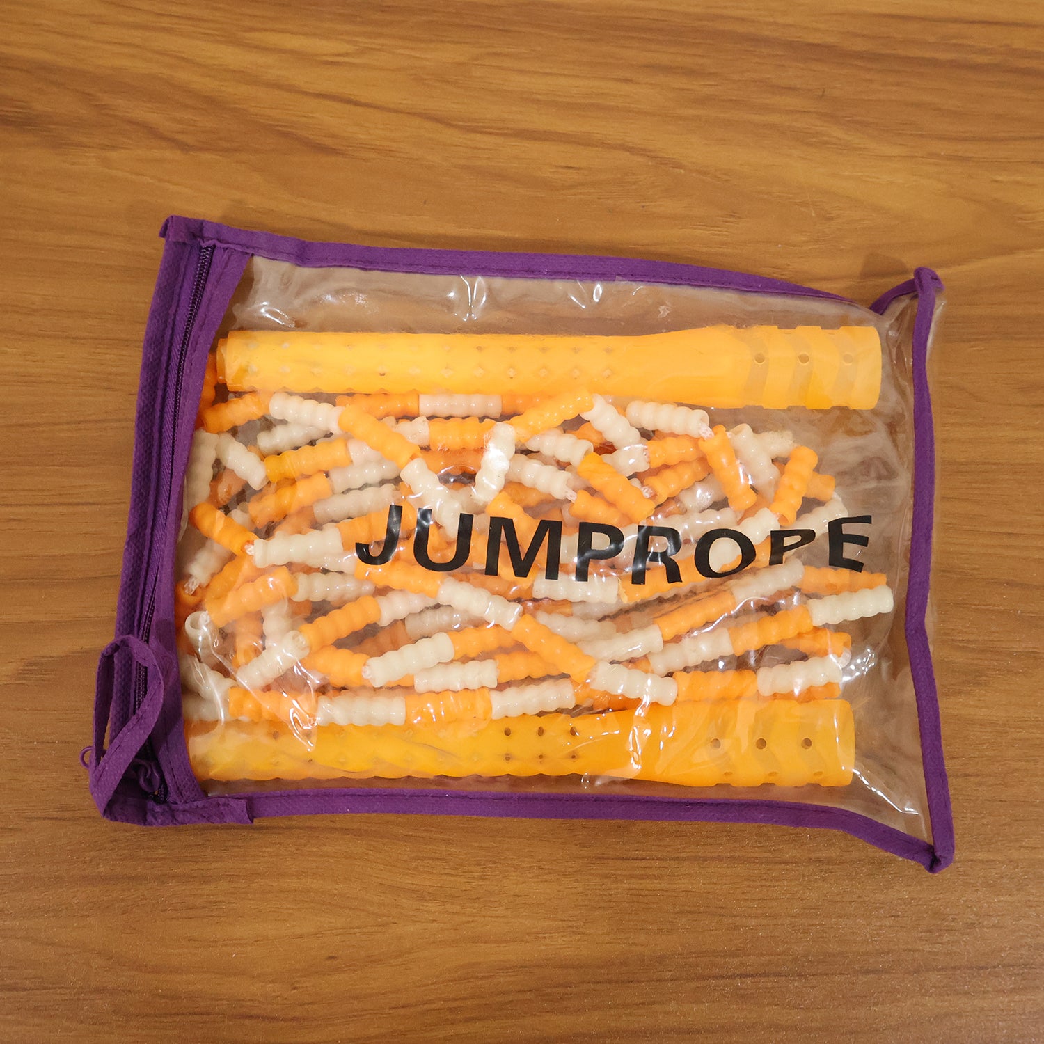 Yellow and white beaded skipping jump rope by Wukusy, showing close-up of beaded handles and colorful rope for fitness or play.